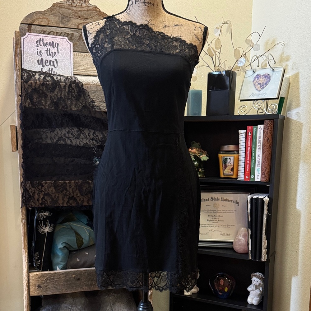 NWT Intimately FREE PEOPLE gorgeous, lacy, and uniquely strappy black dress. L.